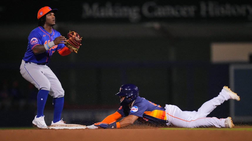 Feb 29, 2024; West Palm Beach, Florida, USA;  Houston Astros outfielder Pedro Leon steals second base as New York Mets second baseman Luisangel Acuna (73) waits for the ball in the seventh inning at The Ballpark of the Palm Beaches. Mandatory Credit: Jim Rassol-USA TODAY Sports