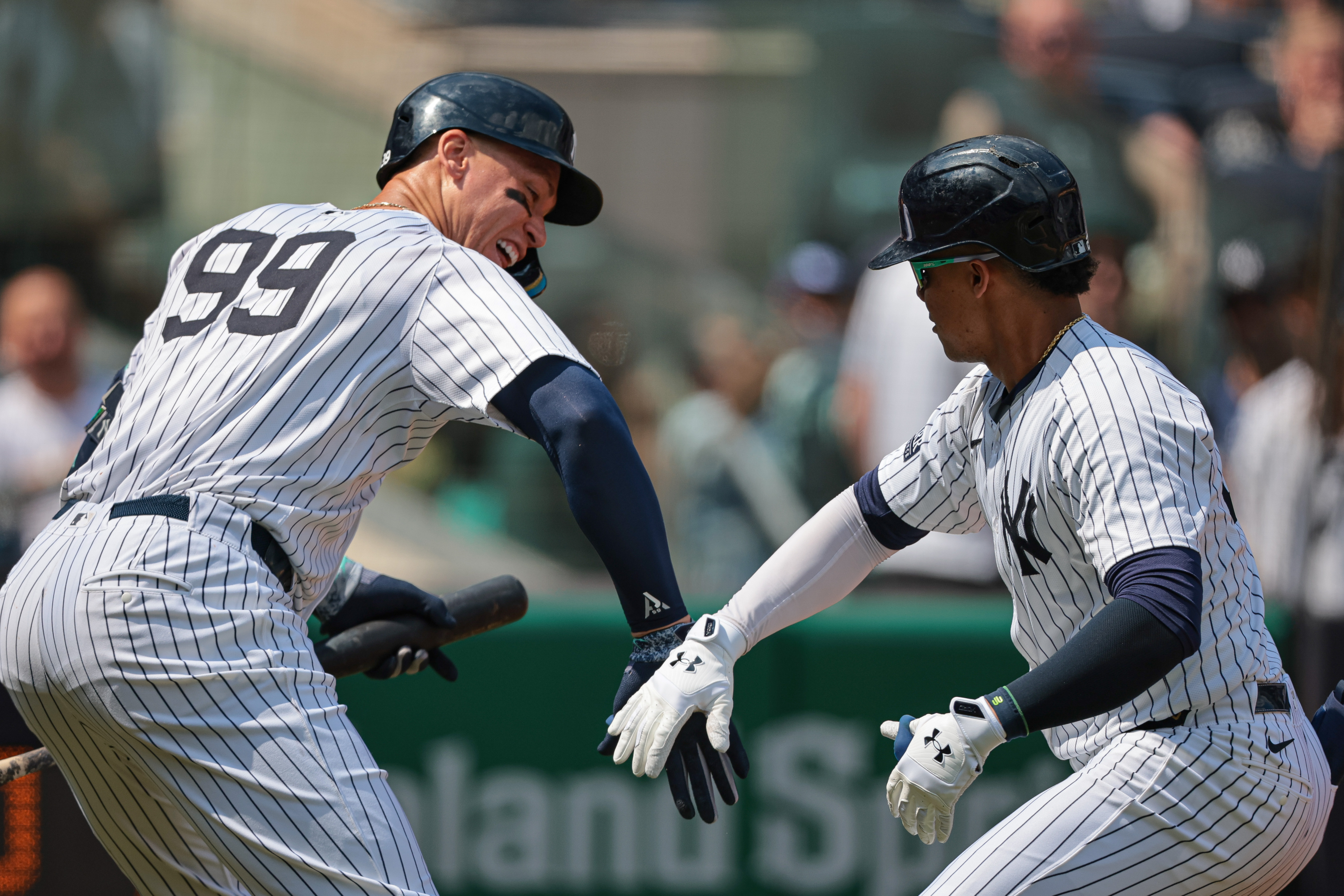 Aug 11, 2024; Bronx, New York, USA; New York Yankees right fielder Juan Soto (22) celebrates with New York Yankees center fielder Aaron Judge (99) after hitting a solo home run during the third inning against the Texas Rangers at Yankee Stadium. Mandatory Credit: Vincent Carchietta-USA TODAY Sports, MLB