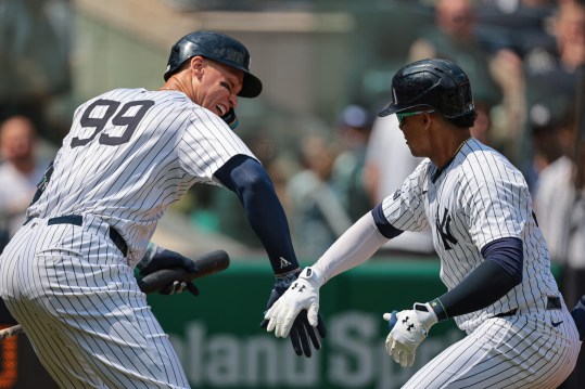 Aug 11, 2024; Bronx, New York, USA;  New York Yankees right fielder Juan Soto (22) celebrates with New York Yankees center fielder Aaron Judge (99) after hitting a solo home run during the third inning against the Texas Rangers at Yankee Stadium. Mandatory Credit: Vincent Carchietta-USA TODAY Sports