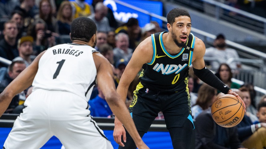 Mar 16, 2024; Indianapolis, Indiana, USA;  Indiana Pacers guard Tyrese Haliburton (0) dribbles the ball while Brooklyn Nets forward Mikal Bridges (1) (New York Knicks)defends in the first half at Gainbridge Fieldhouse. Mandatory Credit: Trevor Ruszkowski-USA TODAY Sports