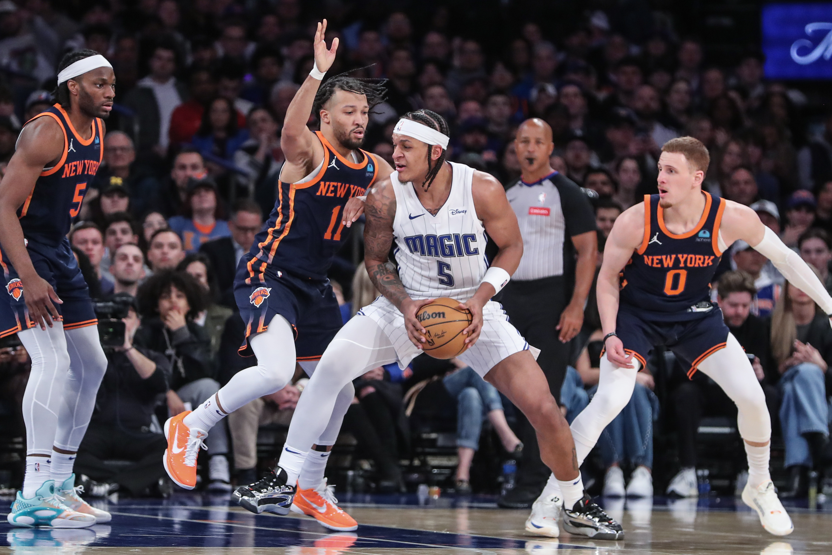 Mar 8, 2024; New York, New York, USA;  Orlando Magic forward Paolo Banchero (5) looks to drive past New York Knicks guard Jalen Brunson (11) in the fourth quarter at Madison Square Garden. Mandatory Credit: Wendell Cruz-USA TODAY Sports