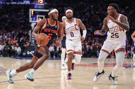 Nov 26, 2023; New York, New York, USA; New York Knicks guard Immanuel Quickley (5) looks to drive past Phoenix Suns forward Nassir Little (25) in the fourth quarter at Madison Square Garden. Mandatory Credit: Wendell Cruz-USA TODAY Sports