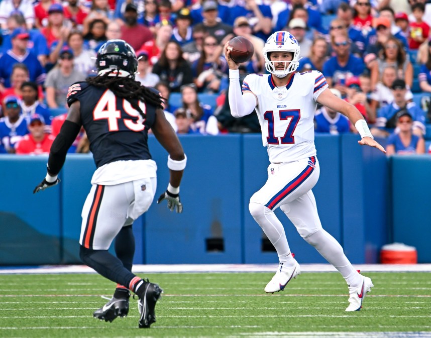 Aug 10, 2024; Orchard Park, New York, USA; Buffalo Bills quarterback Josh Allen (17) tries to avoid Chicago Bears linebacker Tremaine Edmunds (49) in the first quarter of a pre-season game at Highmark Stadium. Mandatory Credit: Mark Konezny-USA TODAY Sports