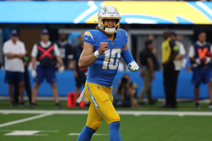 Oct 16, 2023; Inglewood, California, USA;  Los Angeles Chargers quarterback Justin Herbert (10) reacts after throwing a touchdown pass during the first quarter against the Dallas Cowboys at SoFi Stadium. Mandatory Credit: Kiyoshi Mio-USA TODAY Sports