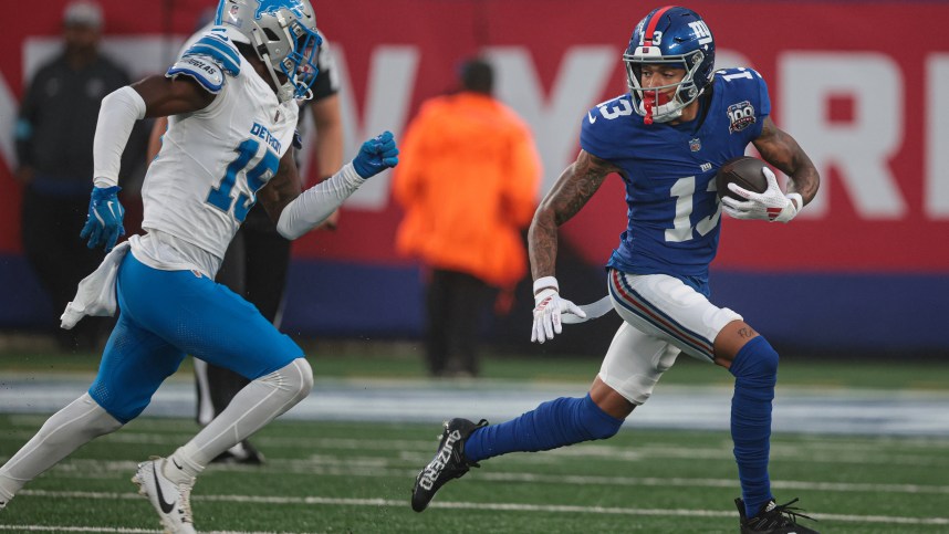 Aug 8, 2024; East Rutherford, New Jersey, USA; New York Giants wide receiver Jalin Hyatt (13) gains yards after catch as Detroit Lions cornerback Ennis Rakestraw Jr. (15) pursues at MetLife Stadium. Mandatory Credit: Vincent Carchietta-USA TODAY Sports