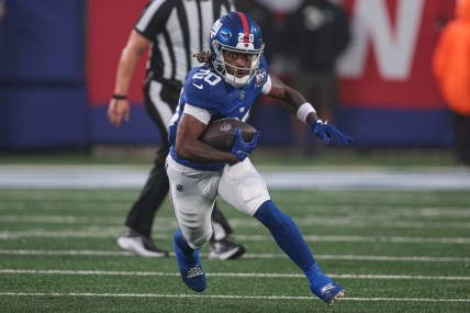 Aug 8, 2024; East Rutherford, New Jersey, USA; New York Giants running back Eric Gray (20) carries the ball during the first half against the Detroit Lions at MetLife Stadium. Mandatory Credit: Vincent Carchietta-USA TODAY Sports