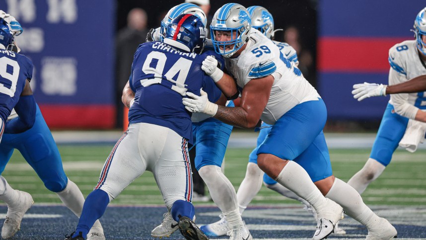 Aug 8, 2024; East Rutherford, New Jersey, USA; Detroit Lions offensive tackle Giovanni Manu (59) blocks New York Giants defensive tackle Elijah Chatman (94) during the second half at MetLife Stadium. Mandatory Credit: Vincent Carchietta-USA TODAY Sports