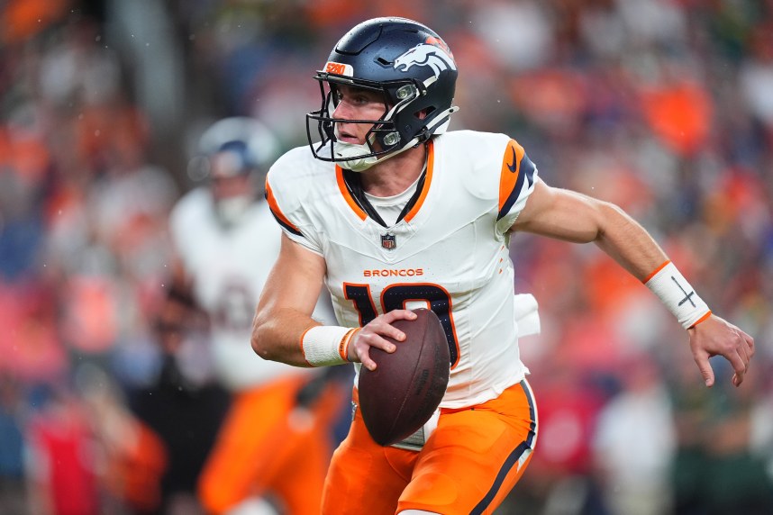 Aug 18, 2024; Denver, Colorado, USA; Denver Broncos quarterback Bo Nix (10) scrambles with the ball in the first quarter against the Green Bay Packers at Empower Field at Mile High. Mandatory Credit: Ron Chenoy-USA TODAY Sports