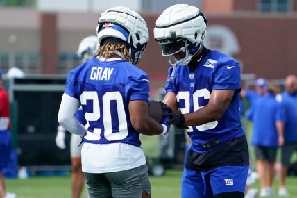 Jul 27, 2023; East Rutherford, NJ, USA;  New York Giants running back Saquon Barkley (26) works with rookie running back Eric Gray (20) on day two of training camp at the Quest Diagnostics Training Facility. Mandatory Credit: Danielle Parhizkaran-USA TODAY Sports