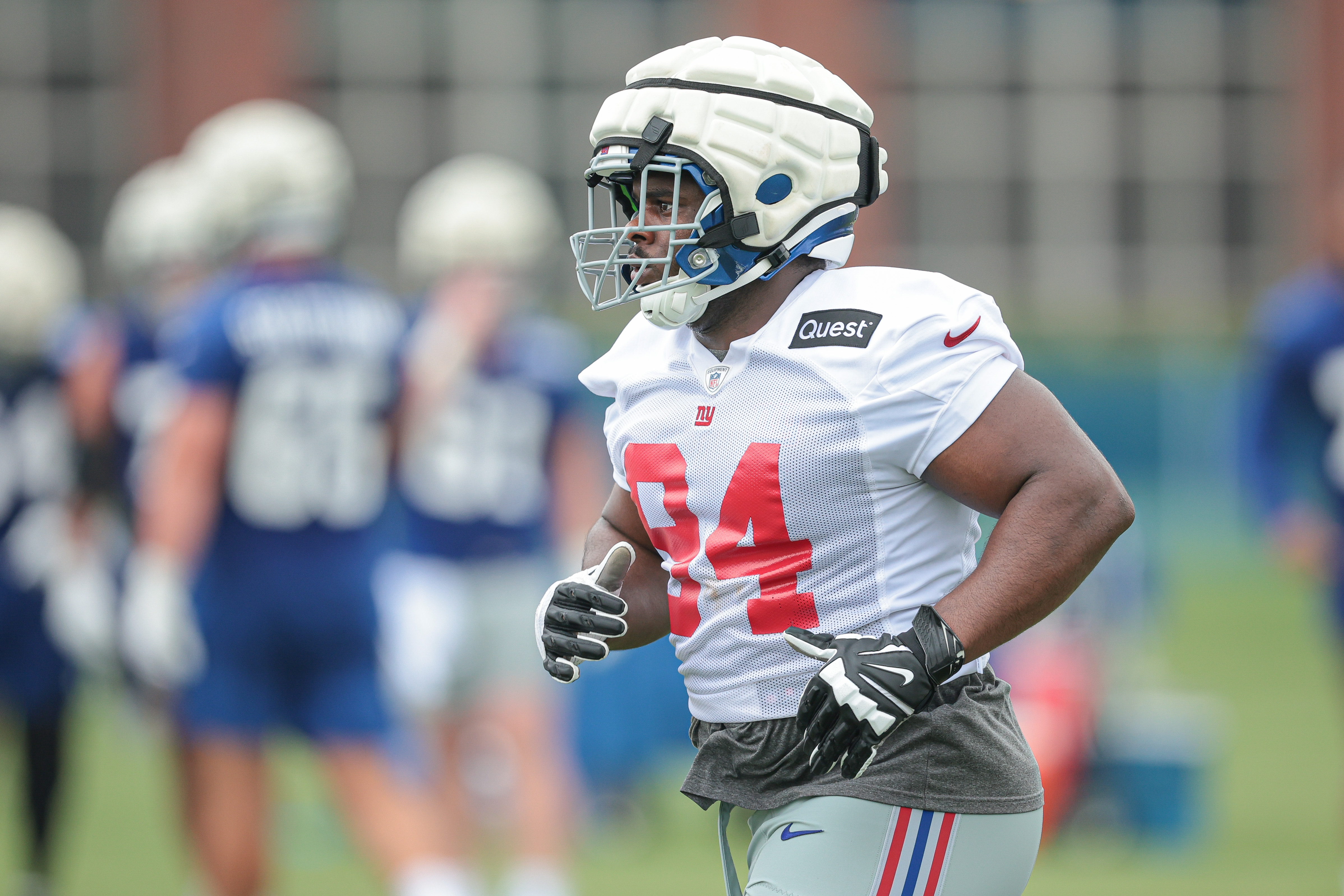 Jul 24, 2024; East Rutherford, NJ, USA; New York Giants defensive tackle Elijah Chatman (94) runs on the field during training camp at Quest Diagnostics Training Facility. Mandatory Credit: Vincent Carchietta-USA TODAY Sports