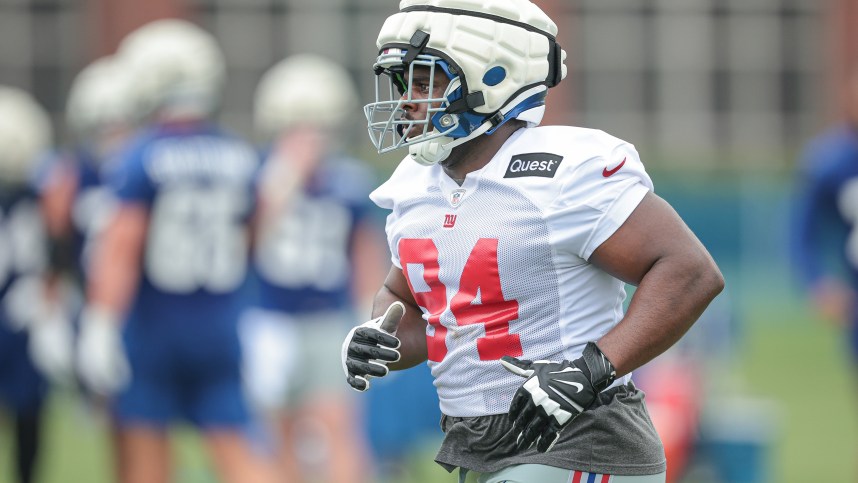 Jul 24, 2024; East Rutherford, NJ, USA; New York Giants defensive tackle Elijah Chatman (94) runs on the field during training camp at Quest Diagnostics Training Facility. Mandatory Credit: Vincent Carchietta-USA TODAY Sports