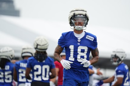 Jul 25, 2024; East Rutherford, NY, USA; New York Giants wide receiver Isaiah Hodgins (18) jogs onto the field during training camp at Quest Diagnostics Training Center. Mandatory Credit: Lucas Boland-USA TODAY Sports