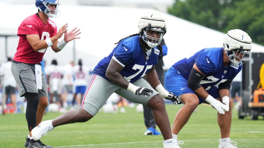 Jul 25, 2024; East Rutherford, NY, USA; New York Giants offensive tackle Joshua Ezeudu (75) participates in a drill during training camp at Quest Diagnostics Training Center. Mandatory Credit: Lucas Boland-USA TODAY Sports