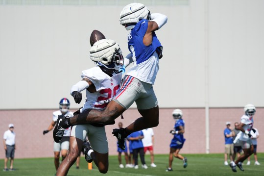 Jul 26, 2024; East Rutherford, NJ, USA; New York Giants cornerback Cordale Flott (28) defends New York Giants wide receiver Malik Nabers (9) during training camp at Quest Diagnostics Training Center. Mandatory Credit: Lucas Boland-USA TODAY Sports