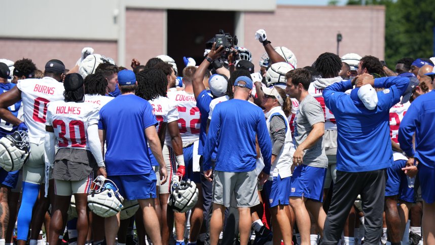 Jul 26, 2024; East Rutherford, NJ, USA; New York Giants players huddle at the end of training camp at Quest Diagnostics Training Center. Mandatory Credit: Lucas Boland-USA TODAY Sports