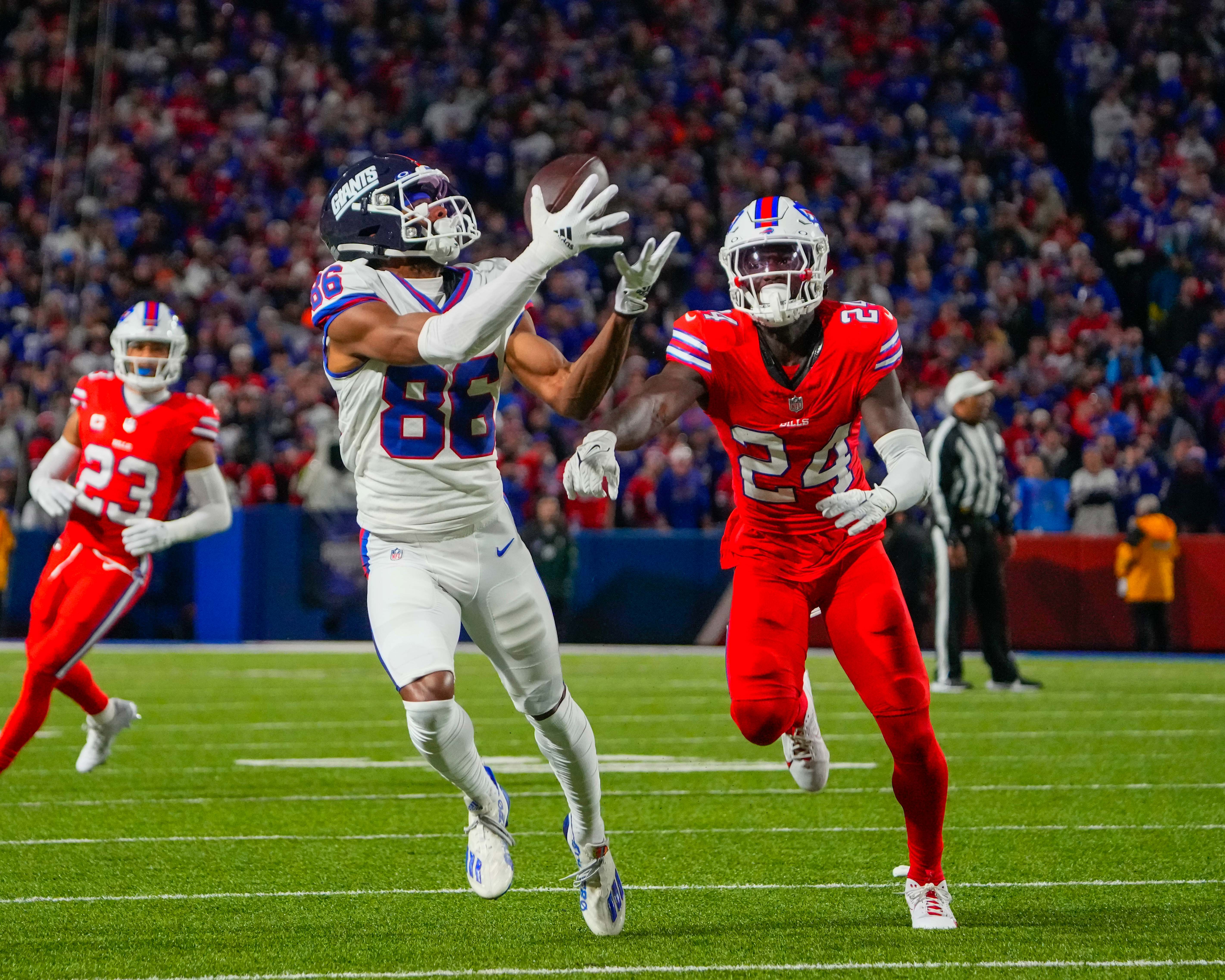 Oct 15, 2023; Orchard Park, New York, USA; New York Giants wide receiver Darius Slayton (86) makes a catch against Buffalo Bills cornerback Kaiir Elam (24) during the first half at Highmark Stadium. Mandatory Credit: Gregory Fisher-USA TODAY Sports