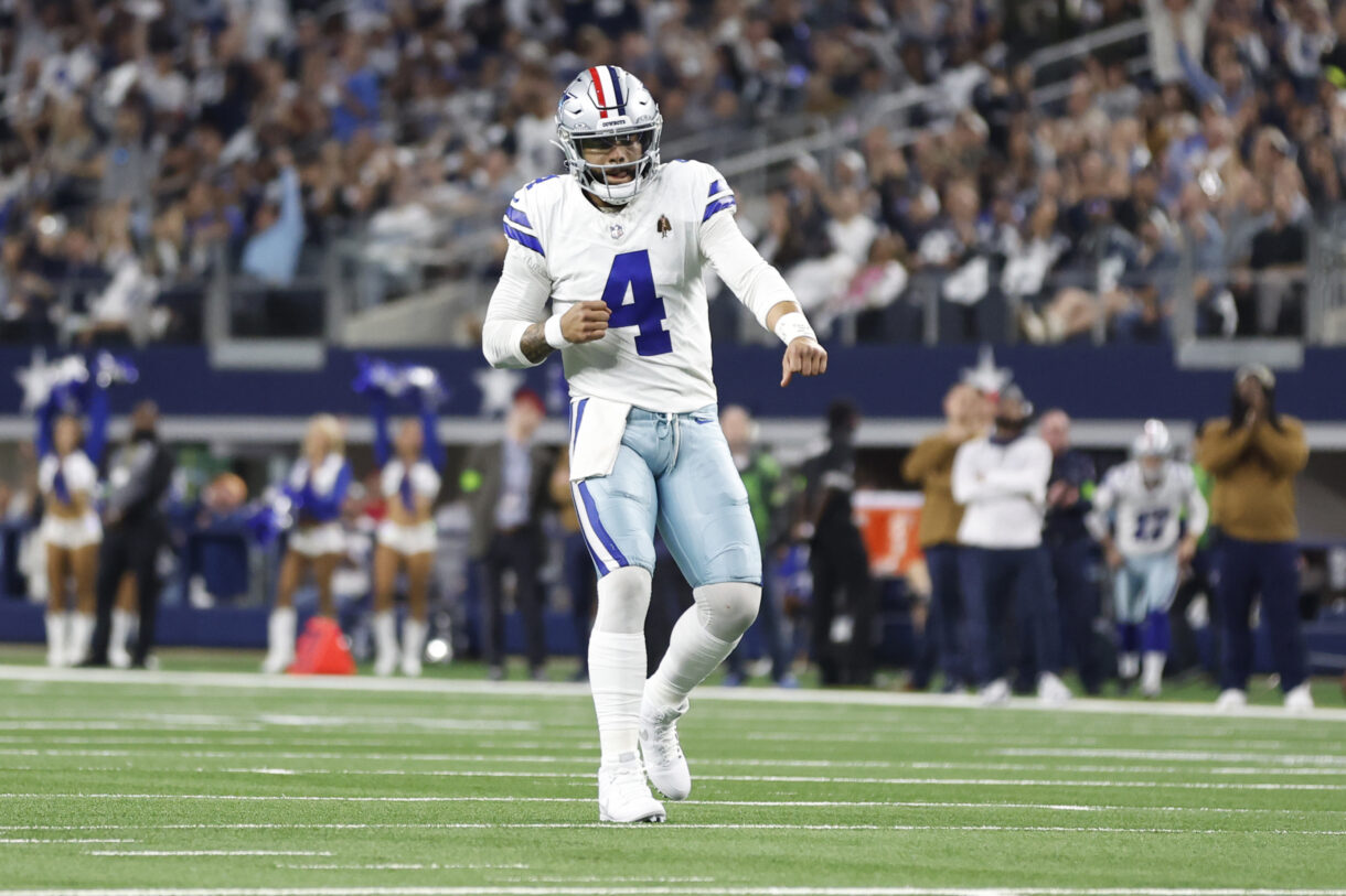 Nov 12, 2023; Arlington, Texas, USA; Dallas Cowboys quarterback Dak Prescott (4) reacts after throwing a touchdown pass in the second quarter against the New York Giants at AT&T Stadium. Mandatory Credit: Tim Heitman-USA TODAY Sports