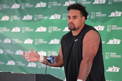 Jul 27, 2024; Florham Park, NJ, USA; New York Jets offensive tackle Olu Fashanu (74) talks with media during training camp at Atlantic Health Jets Training Center. Mandatory Credit: Vincent Carchietta-USA TODAY Sports