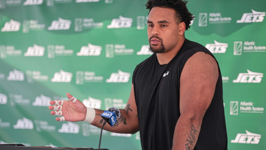 Jul 27, 2024; Florham Park, NJ, USA; New York Jets offensive tackle Olu Fashanu (74) talks with media during training camp at Atlantic Health Jets Training Center. Mandatory Credit: Vincent Carchietta-USA TODAY Sports