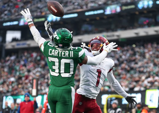 Dec 24, 2023; East Rutherford, New Jersey, USA; New York Jets cornerback Michael Carter II (30) breaks up a pass intended for Washington Commanders wide receiver Jahan Dotson (1) during the second half at MetLife Stadium. Mandatory Credit: Vincent Carchietta-USA TODAY Sports 