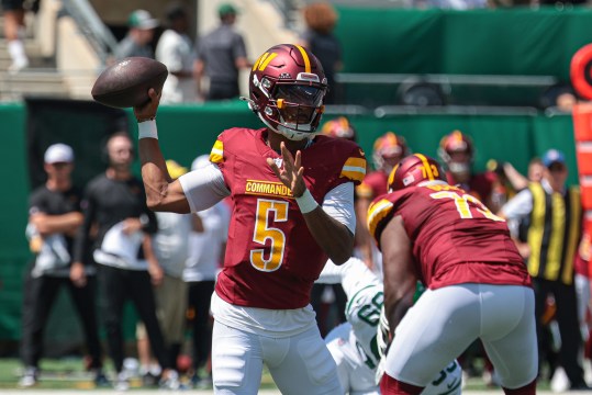 Aug 10, 2024; East Rutherford, New Jersey, USA; Washington Commanders quarterback Jayden Daniels (5) throws the ball during the first quarter against the New York Jets at MetLife Stadium. Mandatory Credit: Vincent Carchietta-USA TODAY Sports