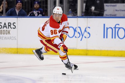 Feb 12, 2024; New York, New York, USA; Calgary Flames left wing Andrei Kuzmenko (96) plays the puck against the New York Rangers during the second period at Madison Square Garden. Mandatory Credit: Brad Penner-USA TODAY Sports