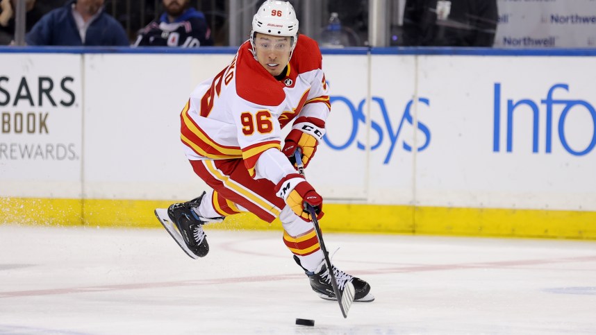 Feb 12, 2024; New York, New York, USA; Calgary Flames left wing Andrei Kuzmenko (96) plays the puck against the New York Rangers during the second period at Madison Square Garden. Mandatory Credit: Brad Penner-USA TODAY Sports