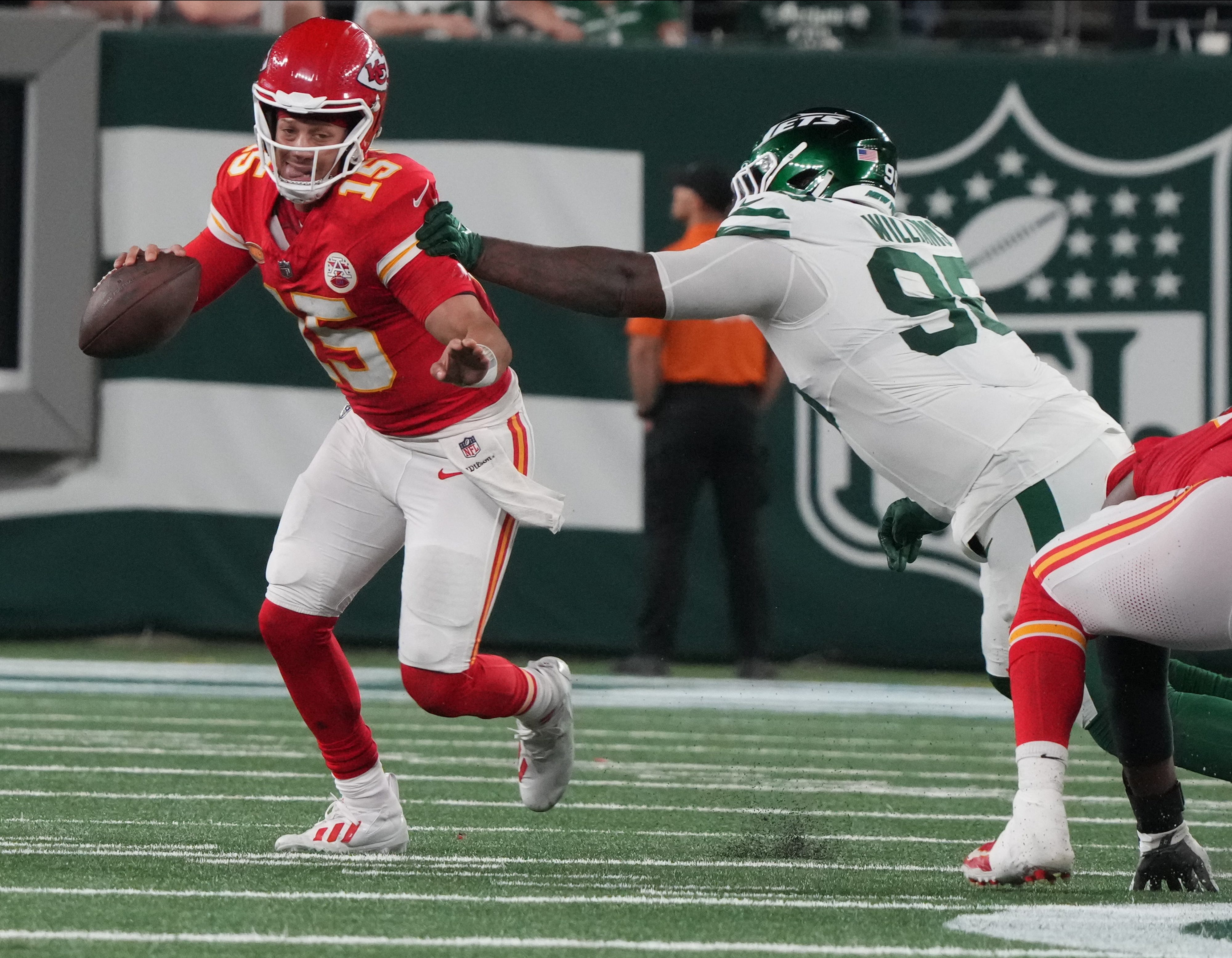 East Rutherford, NJ    October 1, 2023   Chiefs quarterback Patrick Mahomes gets out of the grasp of Quinnen Williams of the Jets in the second half. The New York Jets host the Kansas City Chiefs at MetLife Stadium in East Rutherford, NJ on October 1, 2023.