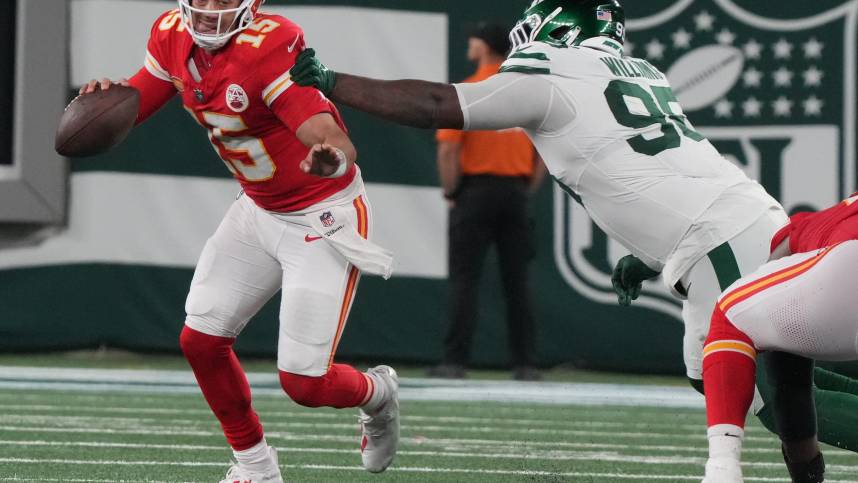 East Rutherford, NJ    October 1, 2023   Chiefs quarterback Patrick Mahomes gets out of the grasp of Quinnen Williams of the Jets in the second half. The New York Jets host the Kansas City Chiefs at MetLife Stadium in East Rutherford, NJ on October 1, 2023.