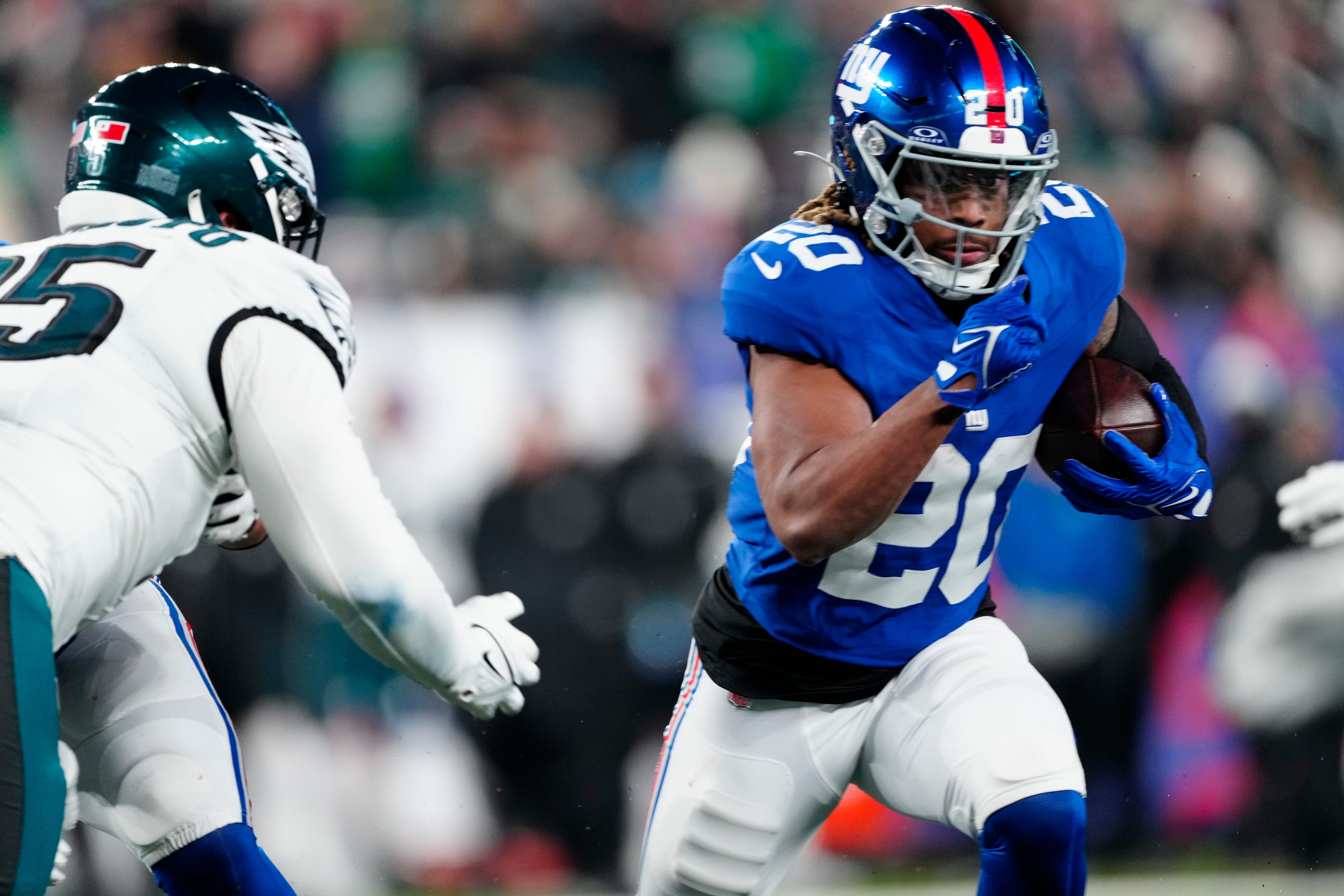 New York Giants running back Eric Gray (20) runs with the ball in the fourth quarter, Sunday, January 7, 2024.