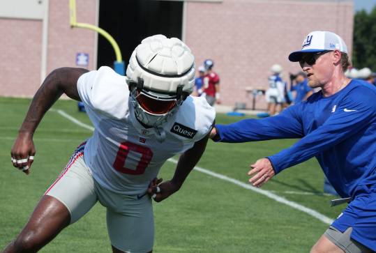 East Rutherford, NJ -- August 1, 2024 -- Linebacker Brian Burns with outside linebacker coach Charlie Bullen practicing today at training camp for the New York Giants.