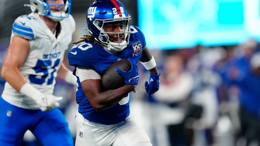 New York Giants running back Eric Gray (20) runs towards the end zone for the first touchdown of the game,, Thursday, August 8 2024, in East Rutherford.