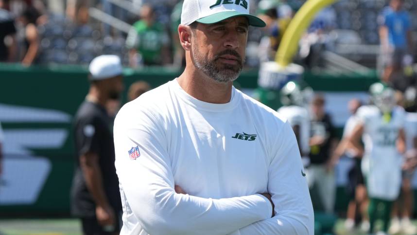 East Rutherford, NJ -- August 10, 2024 -- Aaron Rodgers, who wasn't dressed to play, during pre game warm ups as the Washington Commanders came to MetLife Stadium to play the New York Jets in the first preseason game of the 2024 season.