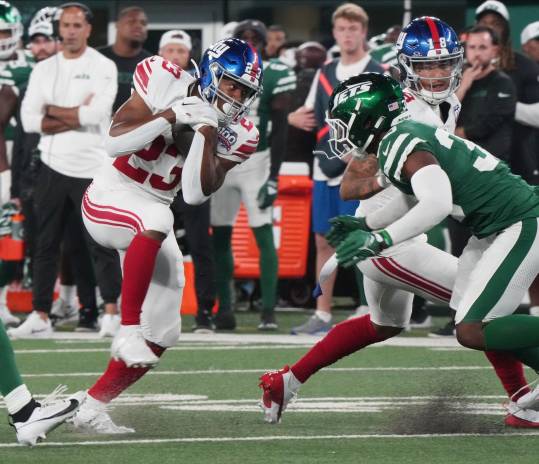 East Rutherford, NJ -- August 24, 2024 -- Joshua Kelley of the Giants runs the ball in the first half. The New York Giants and New York Jets meet at MetLife Stadium in the final preseason game of the 2024 season for both teams.