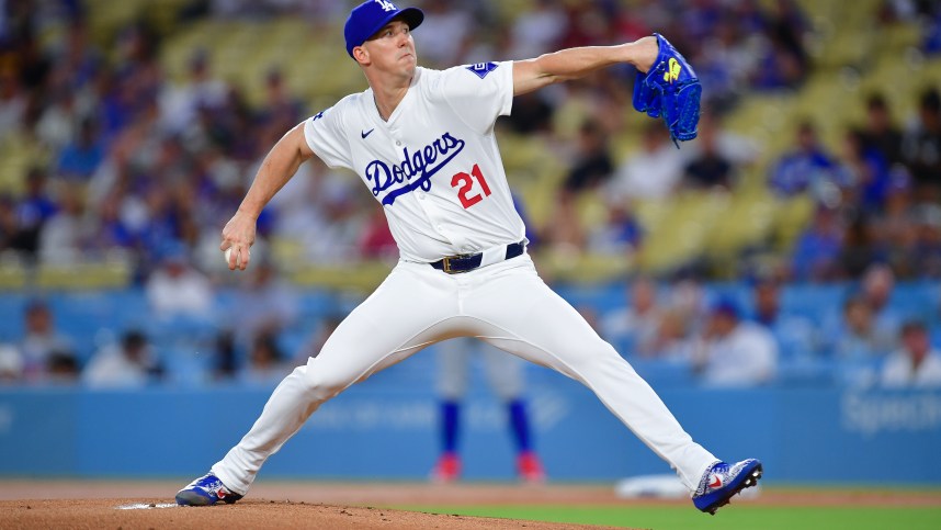 Sep 9, 2024; Los Angeles, California, USA; Los Angeles Dodgers pitcher Walker Buehler (21) throws against the Chicago Cubs during the first inning at Dodger Stadium. Mandatory Credit: Gary A. Vasquez-Imagn Images