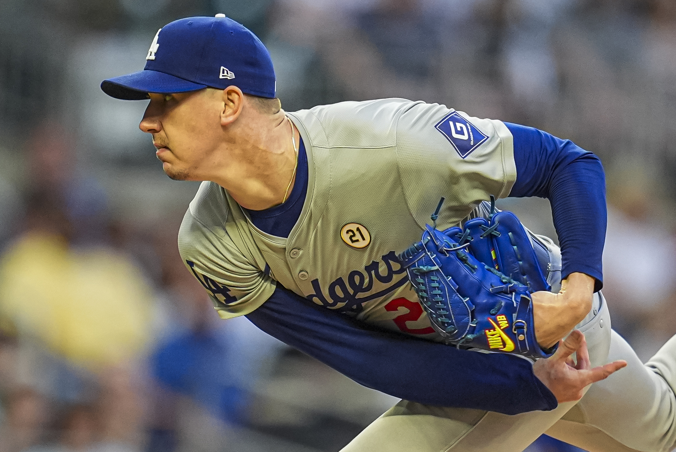 Sep 15, 2024; Cumberland, Georgia, USA; Los Angeles Dodgers starting pitcher Walker Buehler (21) pitches against the Atlanta Braves during the first inning at Truist Park. Mandatory Credit: Dale Zanine-Imagn Images