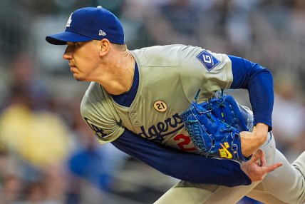 Sep 15, 2024; Cumberland, Georgia, USA; Los Angeles Dodgers starting pitcher Walker Buehler (21) pitches against the Atlanta Braves during the first inning at Truist Park. Mandatory Credit: Dale Zanine-Imagn Images