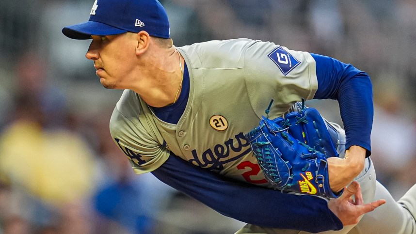 Sep 15, 2024; Cumberland, Georgia, USA; Los Angeles Dodgers starting pitcher Walker Buehler (21) pitches against the Atlanta Braves during the first inning at Truist Park. Mandatory Credit: Dale Zanine-Imagn Images