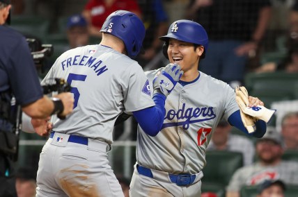 Sep 16, 2024; Atlanta, Georgia, USA; Los Angeles Dodgers first baseman Freddie Freeman (5) celebrates with designated hitter Shohei Ohtani (17) after a three-run home run against the Atlanta Braves in the seventh inning at Truist Park. Mandatory Credit: Brett Davis-Imagn Images