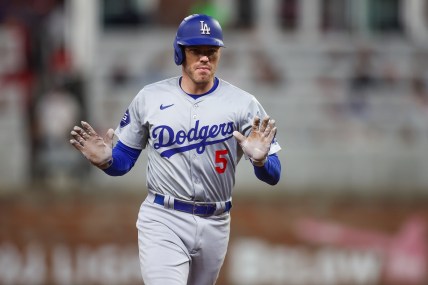 Sep 16, 2024; Atlanta, Georgia, USA; Los Angeles Dodgers first baseman Freddie Freeman (5) celebrates after a three-run home run against the Atlanta Braves in the seventh inning at Truist Park. Mandatory Credit: Brett Davis-Imagn Images