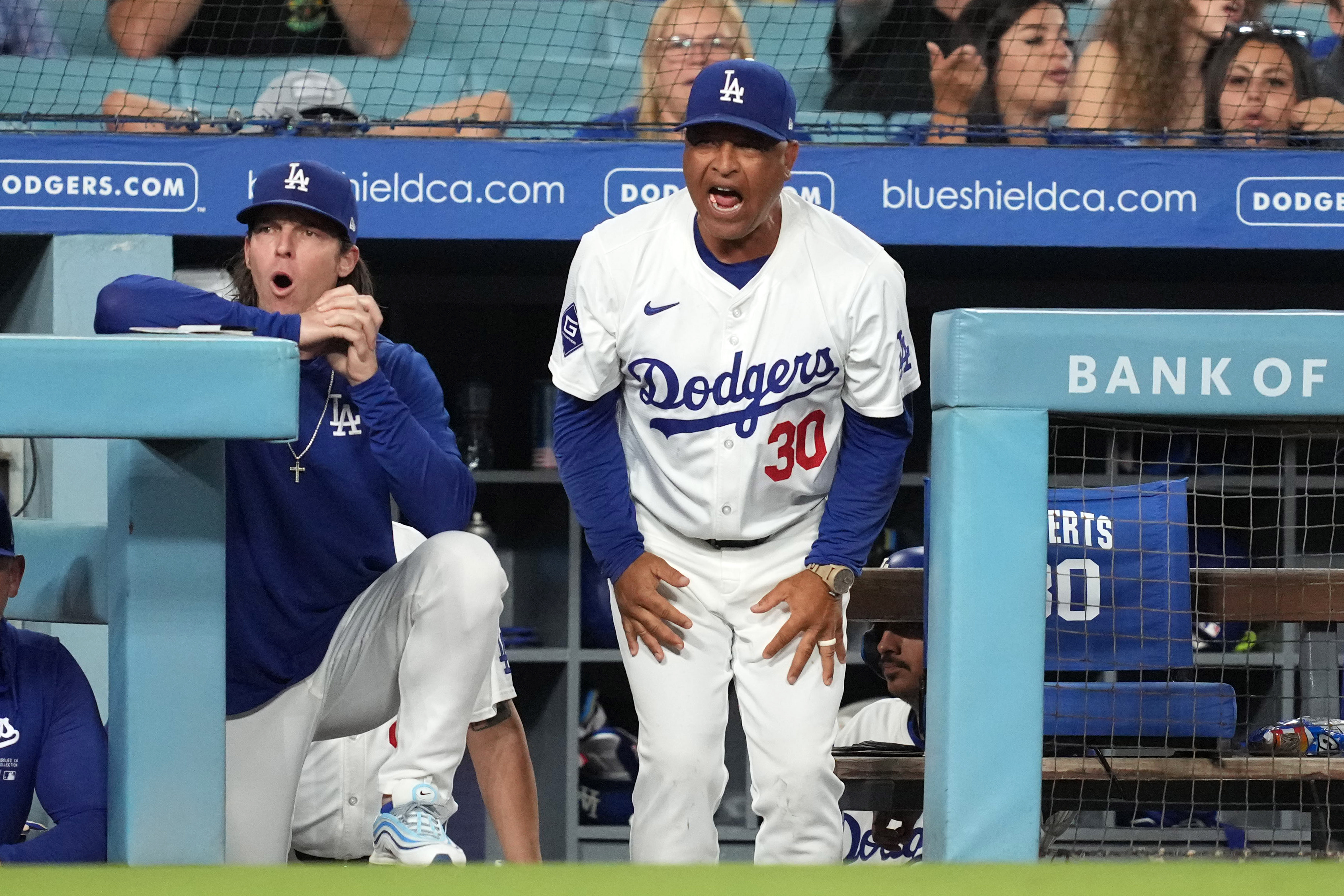 Aug 20, 2024; Los Angeles, California, USA; Los Angeles Dodgers manager Dave Roberts (30) reacts during the game against the Seattle Mariners at Dodger Stadium. Mandatory Credit: Kirby Lee-Imagn Images