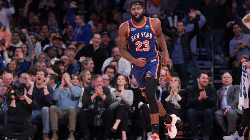 Nov 28, 2023; New York, New York, USA; New York Knicks center Mitchell Robinson (23) reacts after a dunk during the second half against the Charlotte Hornets at Madison Square Garden. Mandatory Credit: Vincent Carchietta-Imagn Images