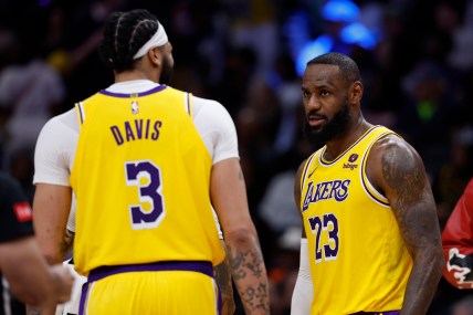 Apr 3, 2024; Washington, District of Columbia, USA; Los Angeles Lakers forward LeBron James (23) talks with Lakers forward Anthony Davis (3) against the Washington Wizards at Capital One Arena. Mandatory Credit: Geoff Burke-Imagn Images