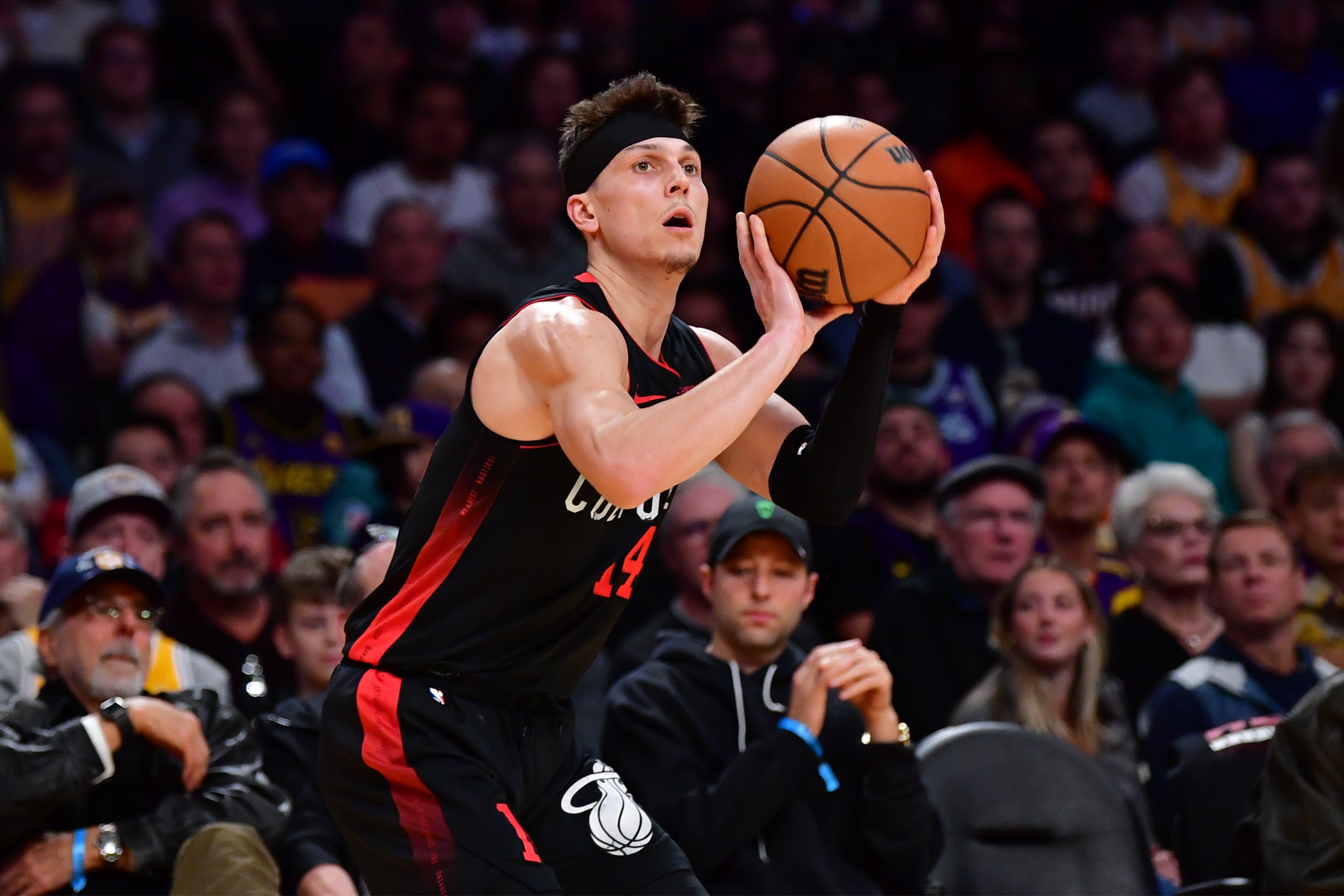 Jan 3, 2024; Los Angeles, California, USA;  Miami Heat guard Tyler Herro (14) shoots against the against the Los Angeles Lakers during the first half at Crypto.com Arena. Mandatory Credit: Gary A. Vasquez-Imagn Images