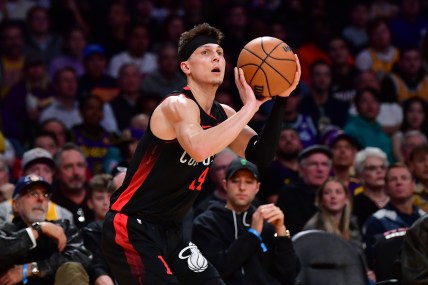 Jan 3, 2024; Los Angeles, California, USA;  Miami Heat guard Tyler Herro (14) shoots against the against the Los Angeles Lakers during the first half at Crypto.com Arena. Mandatory Credit: Gary A. Vasquez-Imagn Images