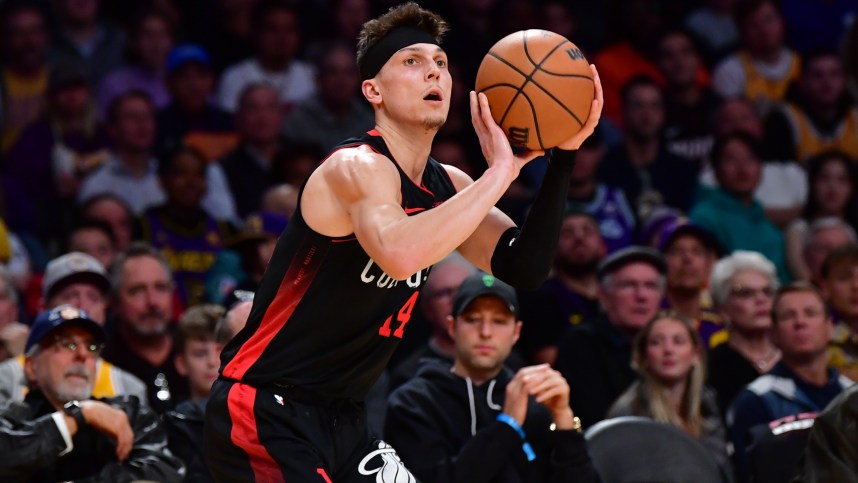 Jan 3, 2024; Los Angeles, California, USA;  Miami Heat guard Tyler Herro (14) shoots against the against the Los Angeles Lakers during the first half at Crypto.com Arena. Mandatory Credit: Gary A. Vasquez-Imagn Images