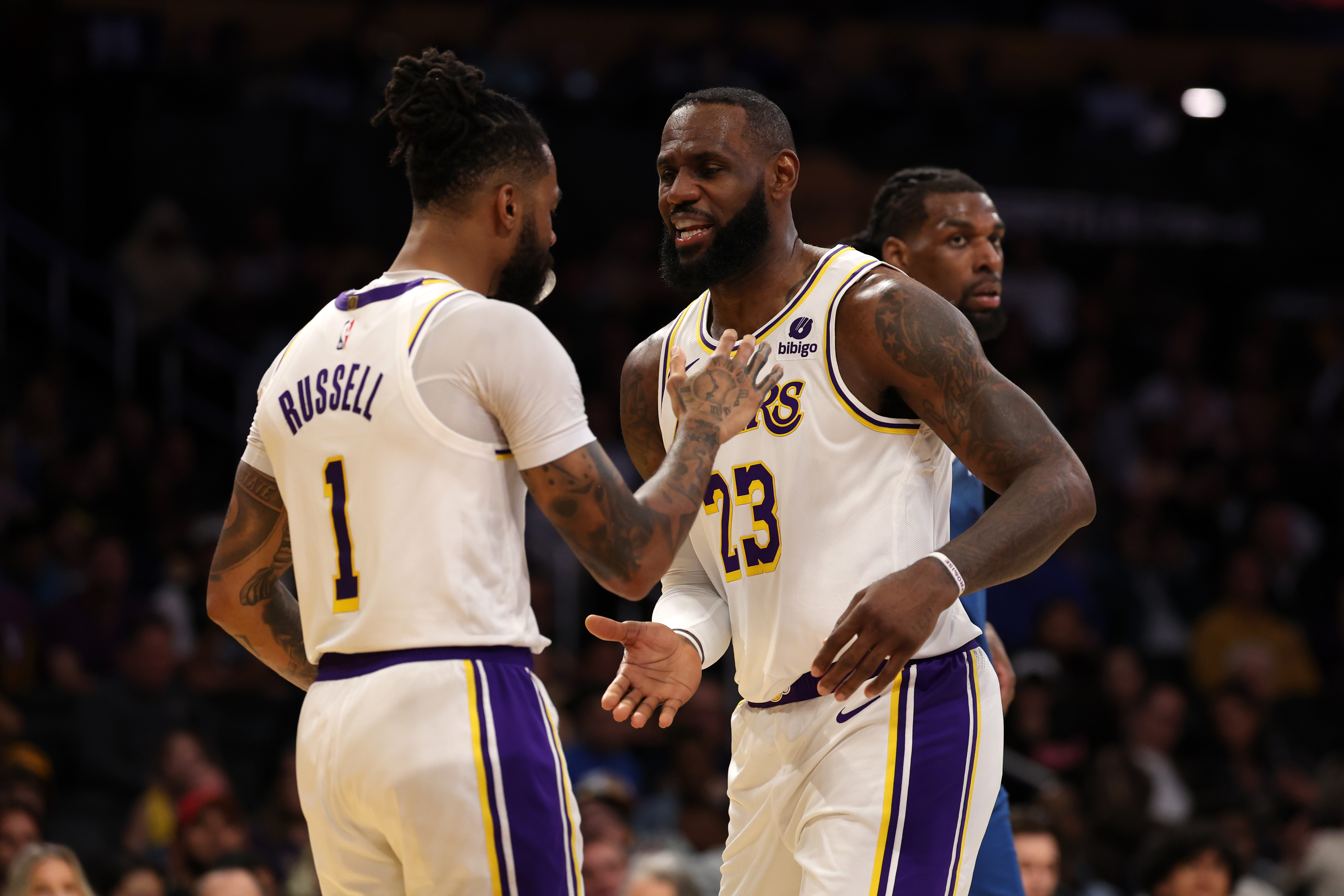 Mar 10, 2024; Los Angeles, California, USA;  Los Angeles Lakers forward LeBron James (23) greets guard D'Angelo Russell (1) after Russell scored a basket during the second quarter against the Minnesota Timberwolves at Crypto.com Arena. Mandatory Credit: Kiyoshi Mio-Imagn Images