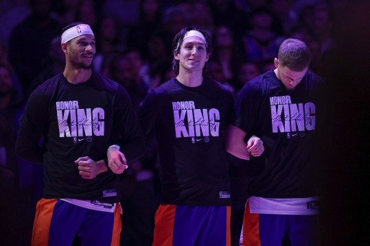 Jan 15, 2024; New York, New York, USA; New York Knicks guard Josh Hart (3), guard Ryan Arcidiacono (51), and guard Donte DiVincenzo (0) stand for the national anthem while wearing shirts honoring Martin Luther King Jr. before the game against the Orlando Magic at Madison Square Garden. Mandatory Credit: Vincent Carchietta-Imagn Images