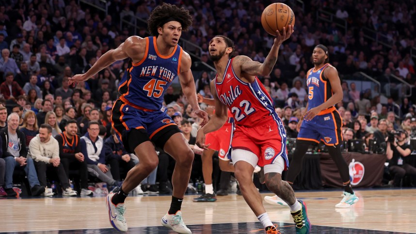 Mar 10, 2024; New York, New York, USA; Philadelphia 76ers guard Cameron Payne (22) drives to the basket against New York Knicks center Jericho Sims (45) and forward Precious Achiuwa (5) during the second quarter at Madison Square Garden. Mandatory Credit: Brad Penner-USA TODAY Sports