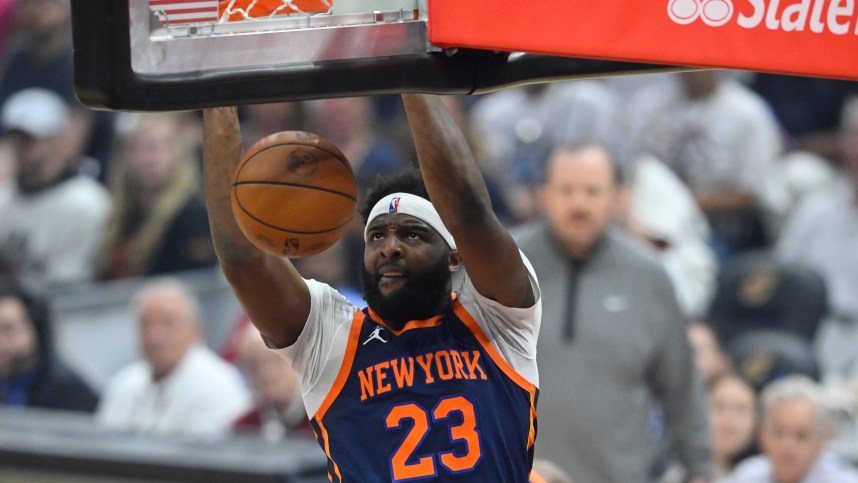 Apr 15, 2023; Cleveland, Ohio, USA; New York Knicks center Mitchell Robinson (23) dunks against the Cleveland Cavaliers in the first quarter of game one of the 2023 NBA playoffs at Rocket Mortgage FieldHouse. Mandatory Credit: David Richard-Imagn Images